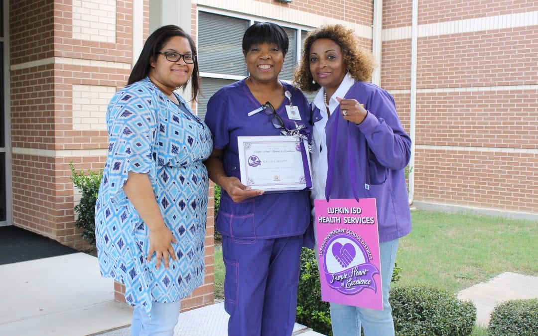 Purple Heart of Excellence Award given to Necole Wyatt
