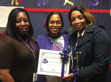 Nurse Mitchell receives the Purple Heart of Excellence Award