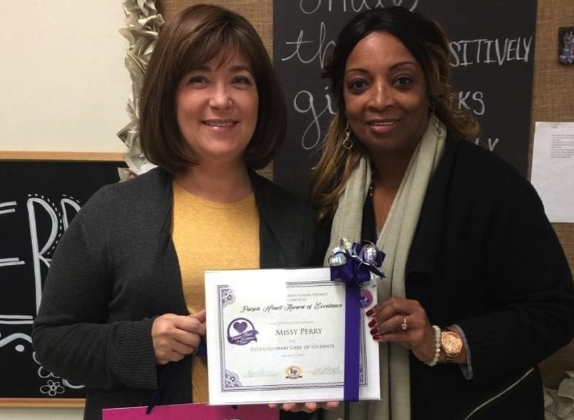 Nurse Perry receives the Purple Heart of Excellence Award